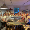 17 Men Holding Banner After Raising Money For Mind Swansea